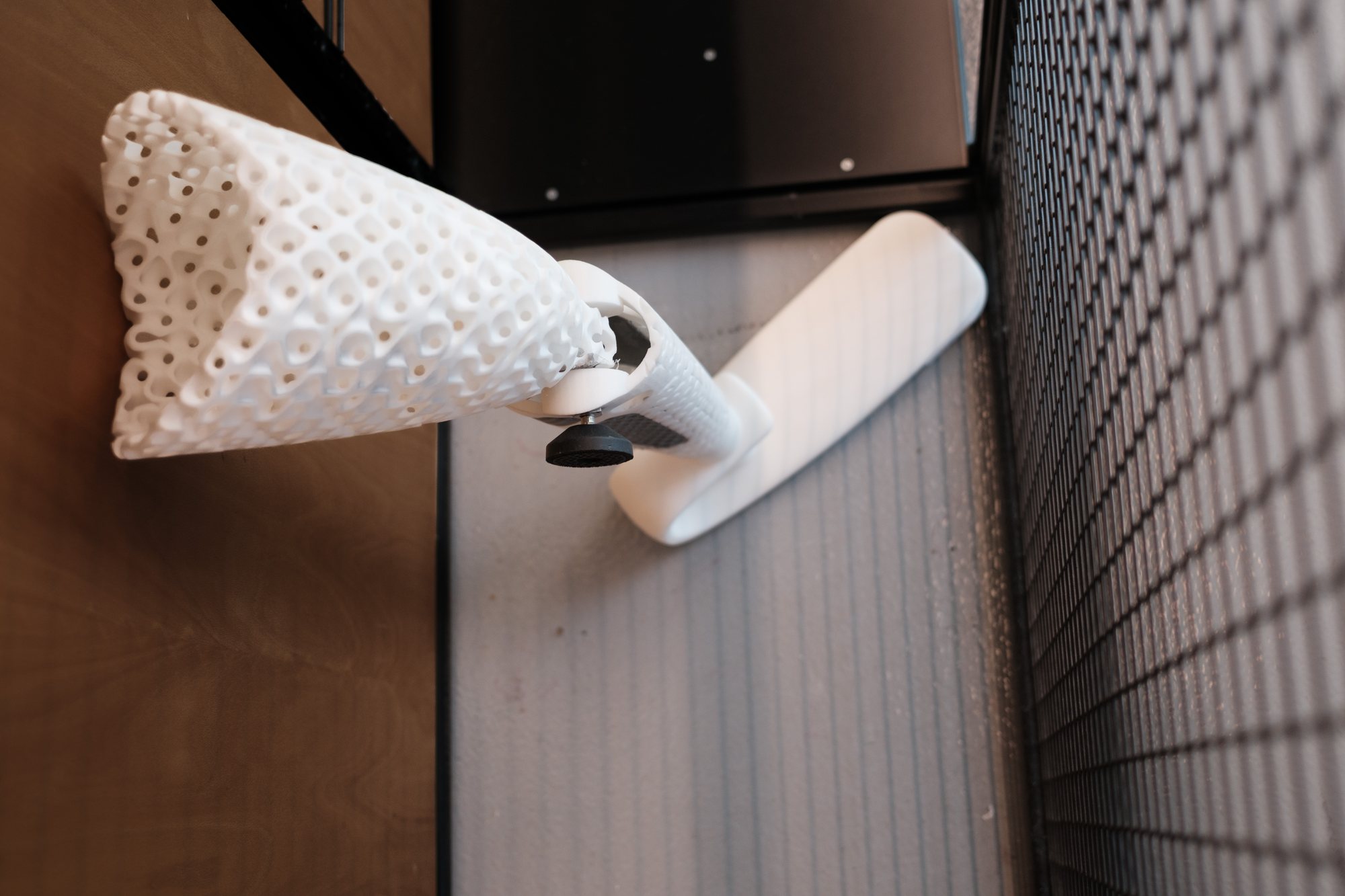 A discarded robot leg, with a floor plan drifting across it